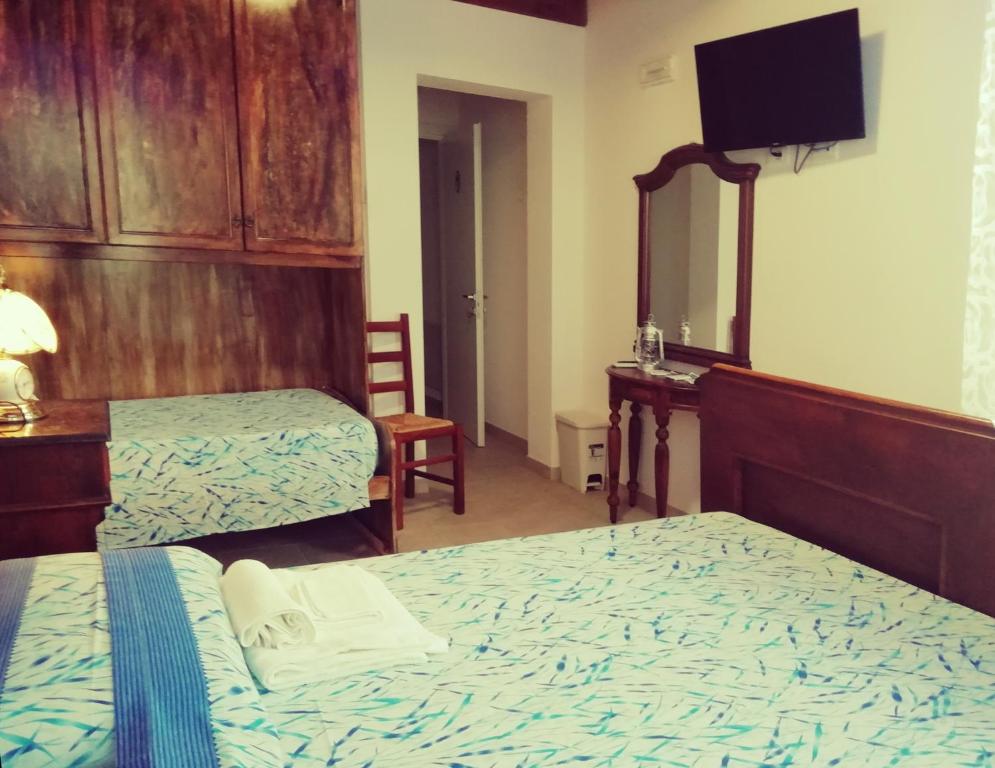 Postel nebo postele na pokoji v ubytování Le mille e una notte
