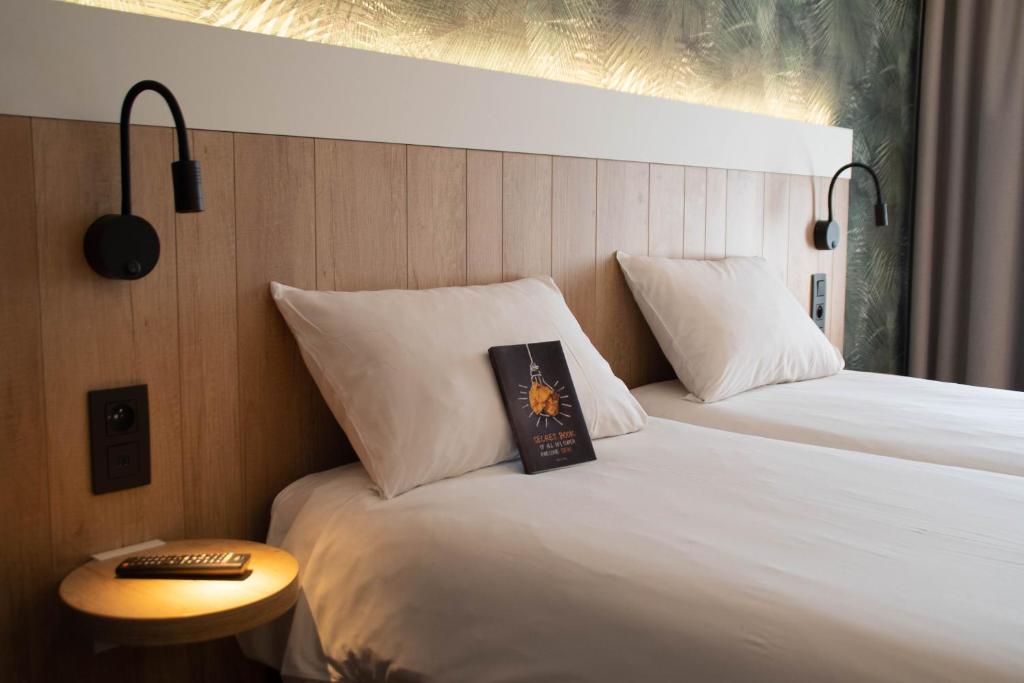 Postel nebo postele na pokoji v ubytování ibis Brussels Waterloo