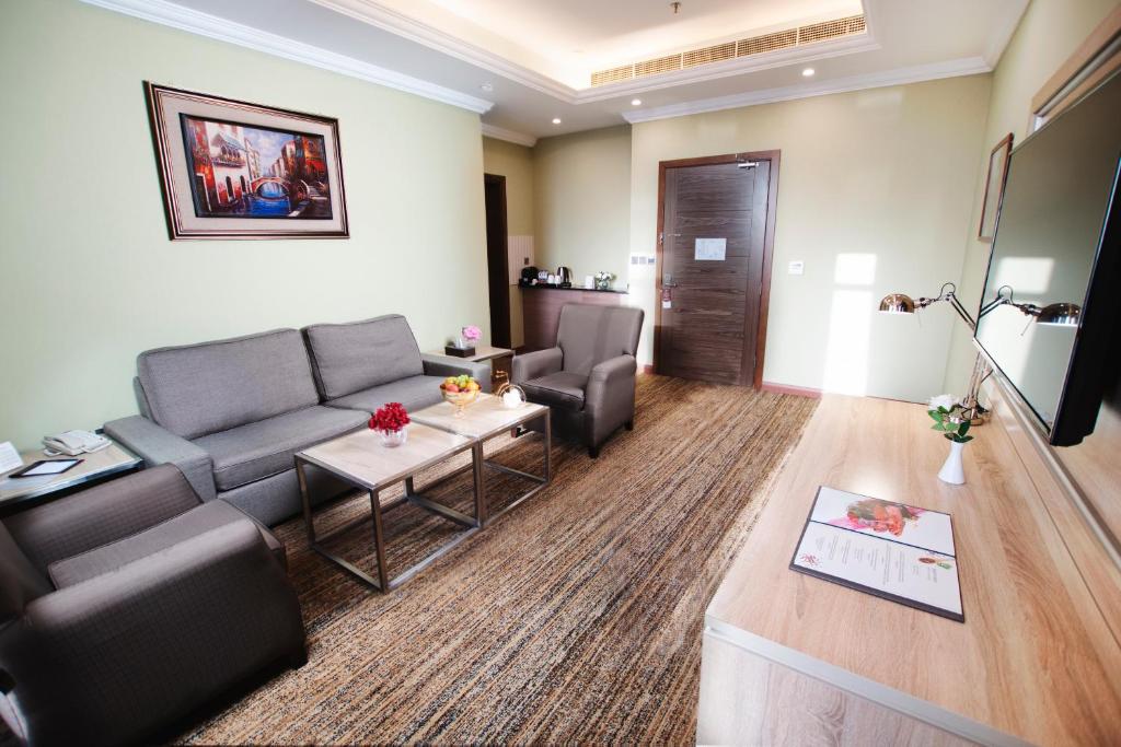 TV a/nebo společenská místnost v ubytování Iridium 70 Hotel