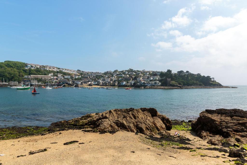 a view of a body of water with a town at Crimpers Cottage in Fowey