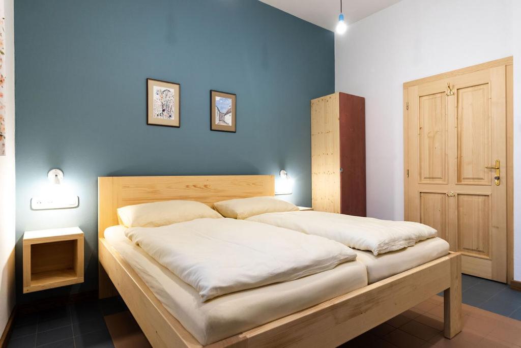 Postel nebo postele na pokoji v ubytování Dům Přátel Pavlova