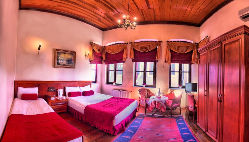 Postel nebo postele na pokoji v ubytování Kervansaray Canakkale Hotel - Special Category