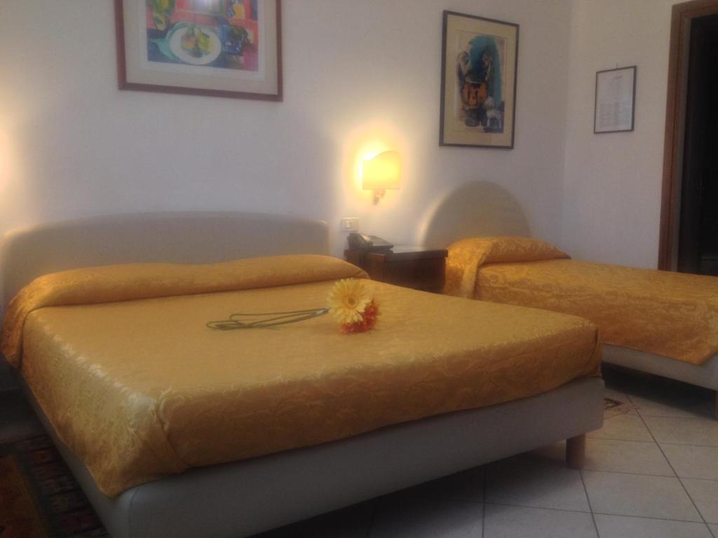 Postel nebo postele na pokoji v ubytování Hotel Caldin's