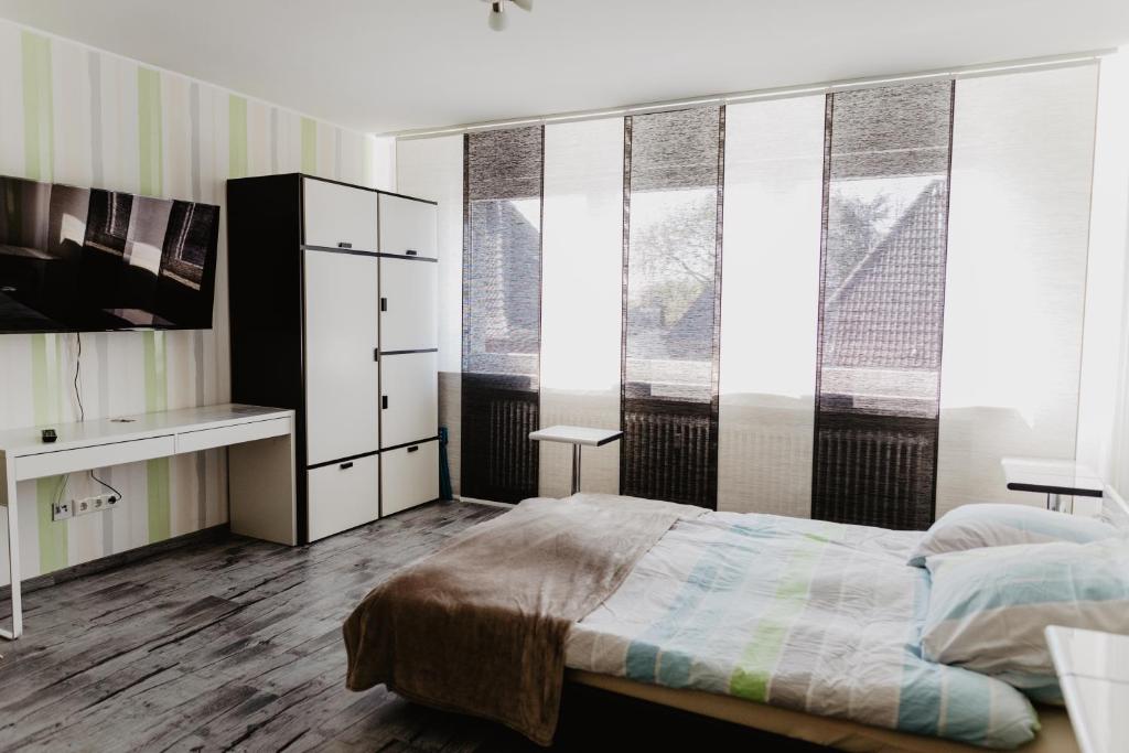 Postel nebo postele na pokoji v ubytování SK Apartments - Green