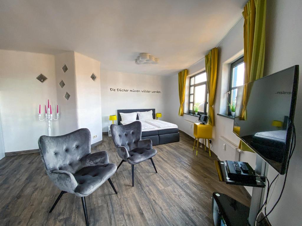TV a/nebo společenská místnost v ubytování apartHOTEL Magdeburg