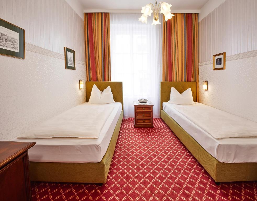 Postel nebo postele na pokoji v ubytování Hotel Austria - Wien