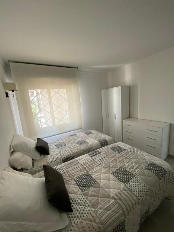 Posteľ alebo postele v izbe v ubytovaní Apartament El Far