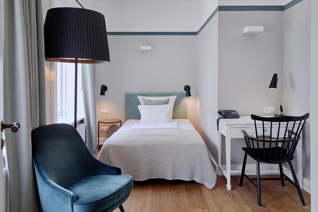 Postel nebo postele na pokoji v ubytování Landhaus Flottbek Boutique Hotel