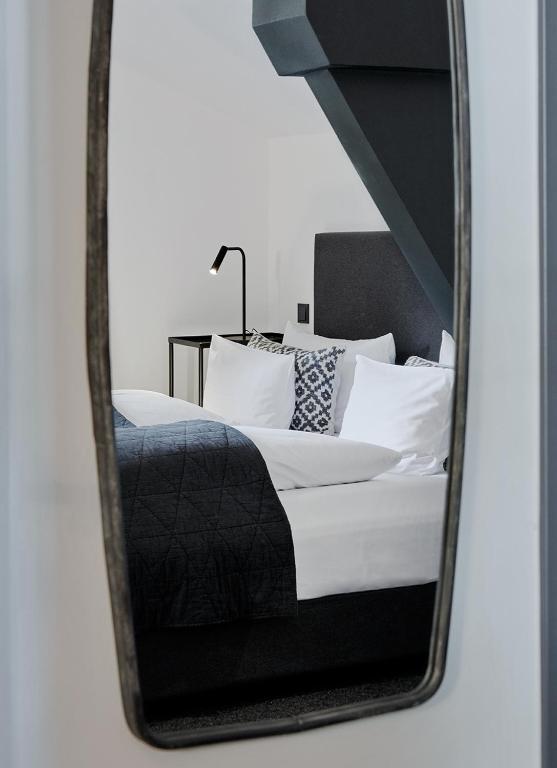 Postel nebo postele na pokoji v ubytování Landhaus Flottbek Boutique Hotel
