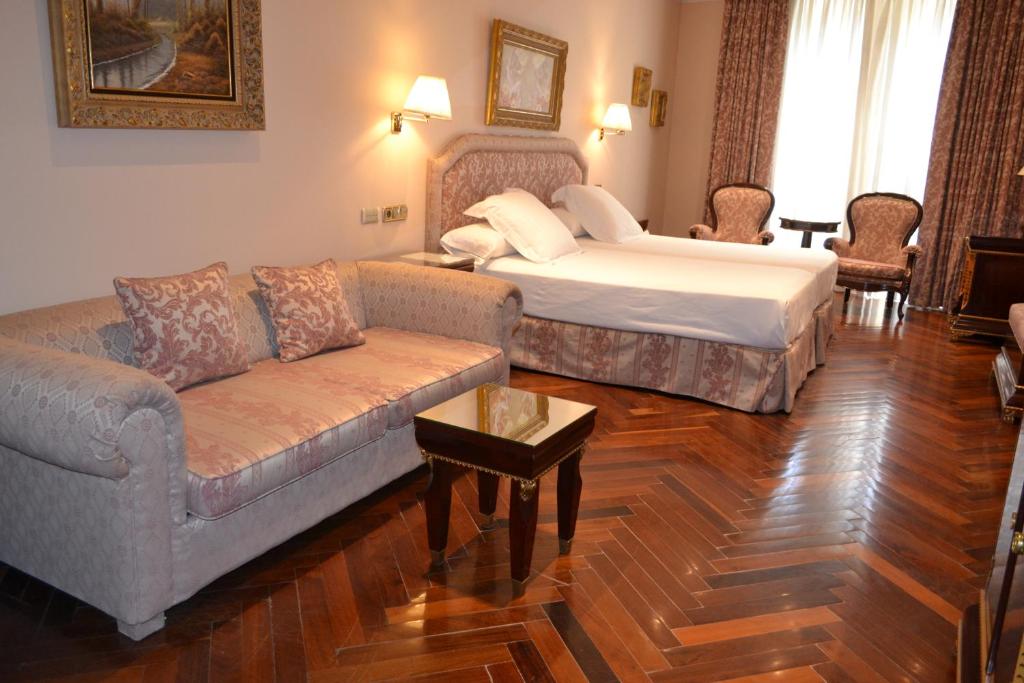 Postel nebo postele na pokoji v ubytování Hotel Alameda Palace