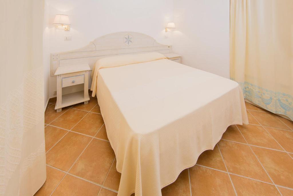 Postel nebo postele na pokoji v ubytování Colonna Beach Hotel Marinella