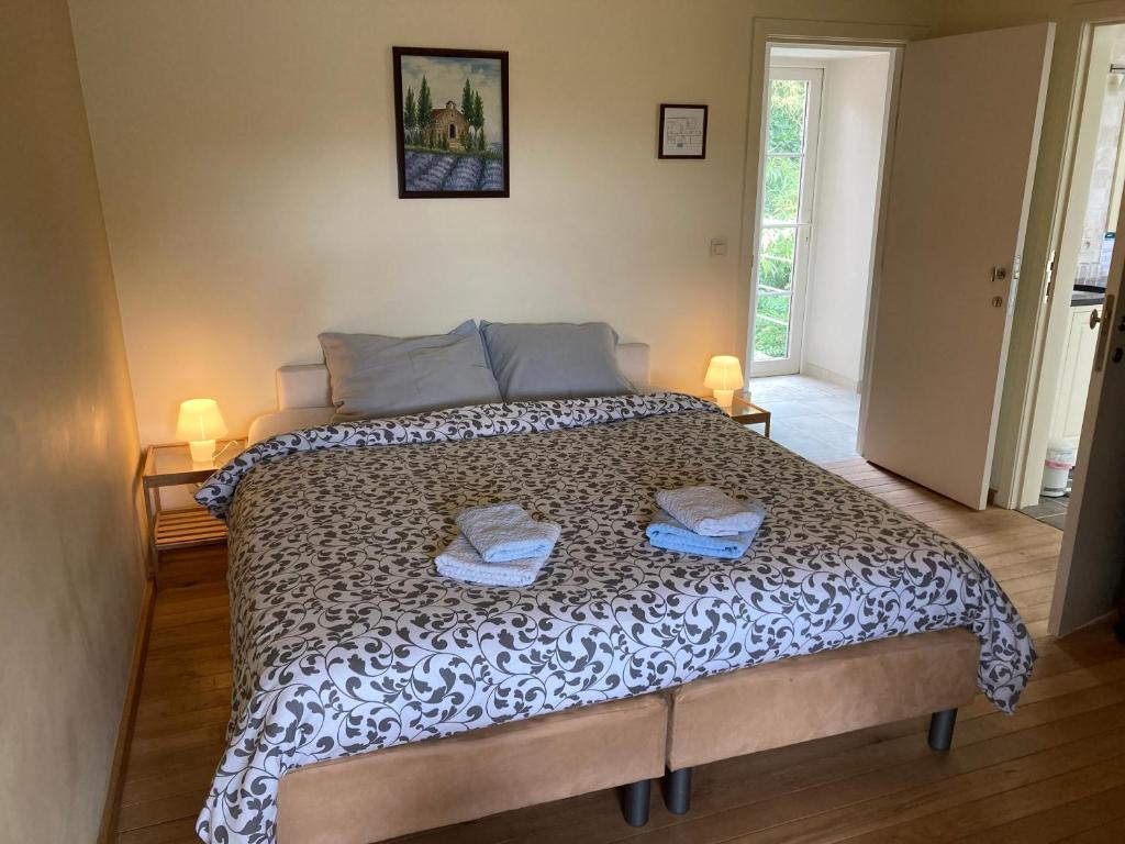 Postel nebo postele na pokoji v ubytování B&B Molen Ter Walle