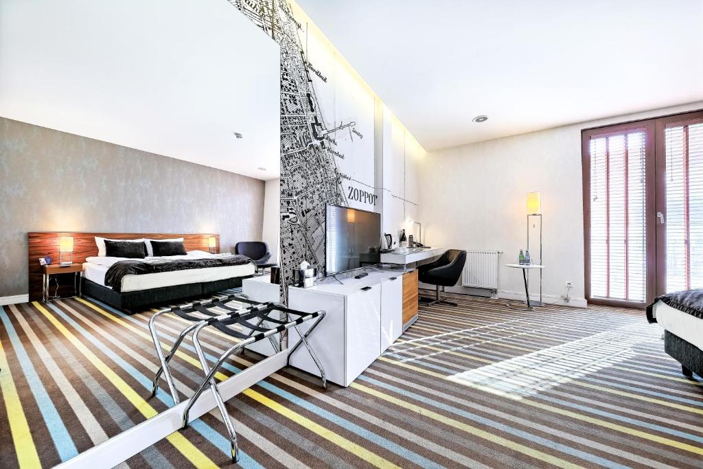Postel nebo postele na pokoji v ubytování Bayjonn Boutique Hotel