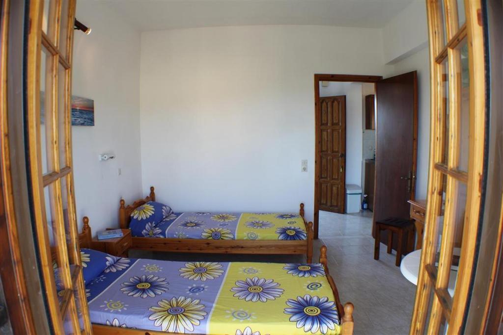 Postel nebo postele na pokoji v ubytování Nikolas House