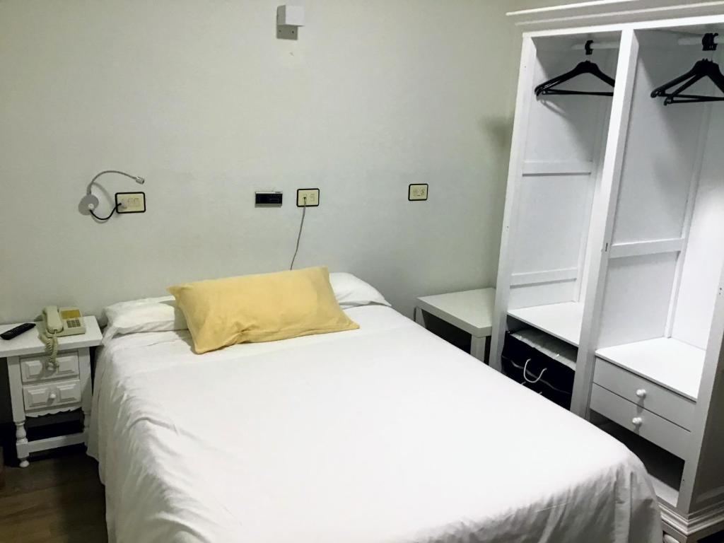 Posteľ alebo postele v izbe v ubytovaní Hotel Los Olmos