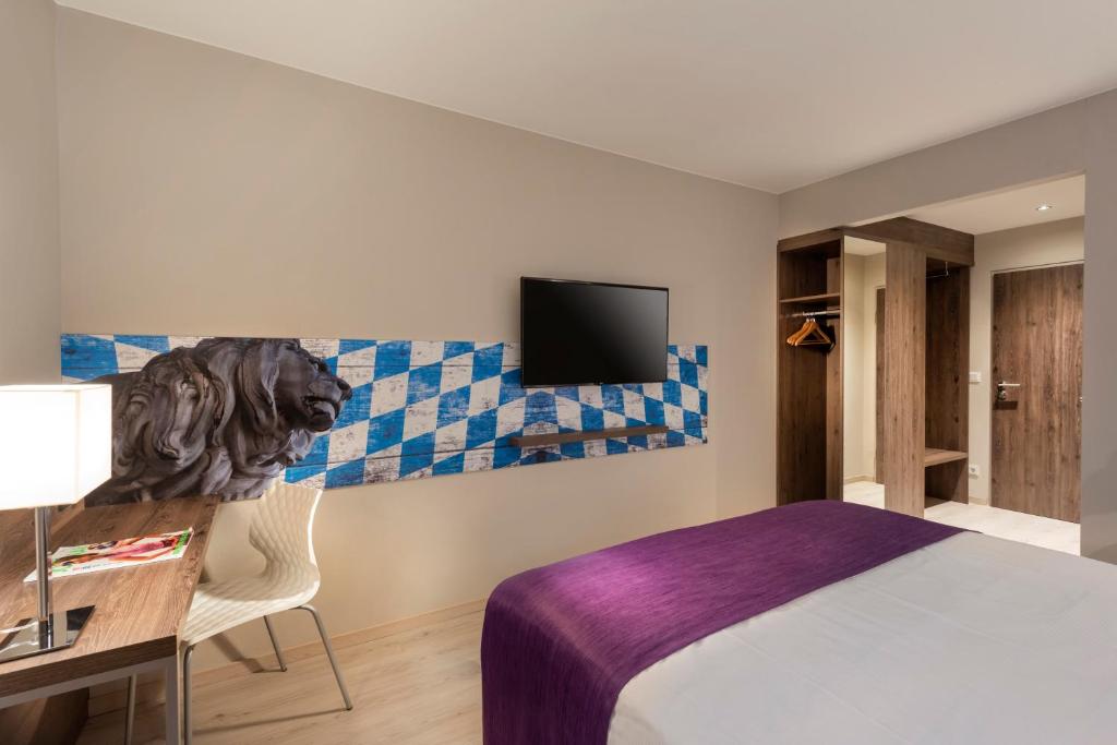 Postel nebo postele na pokoji v ubytování Tryp by Wyndham Rosenheim