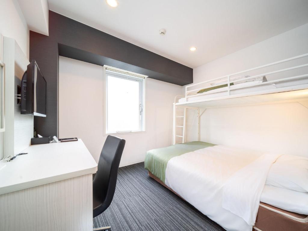 Postel nebo postele na pokoji v ubytování Super Hotel Shinagawa Shinbanba