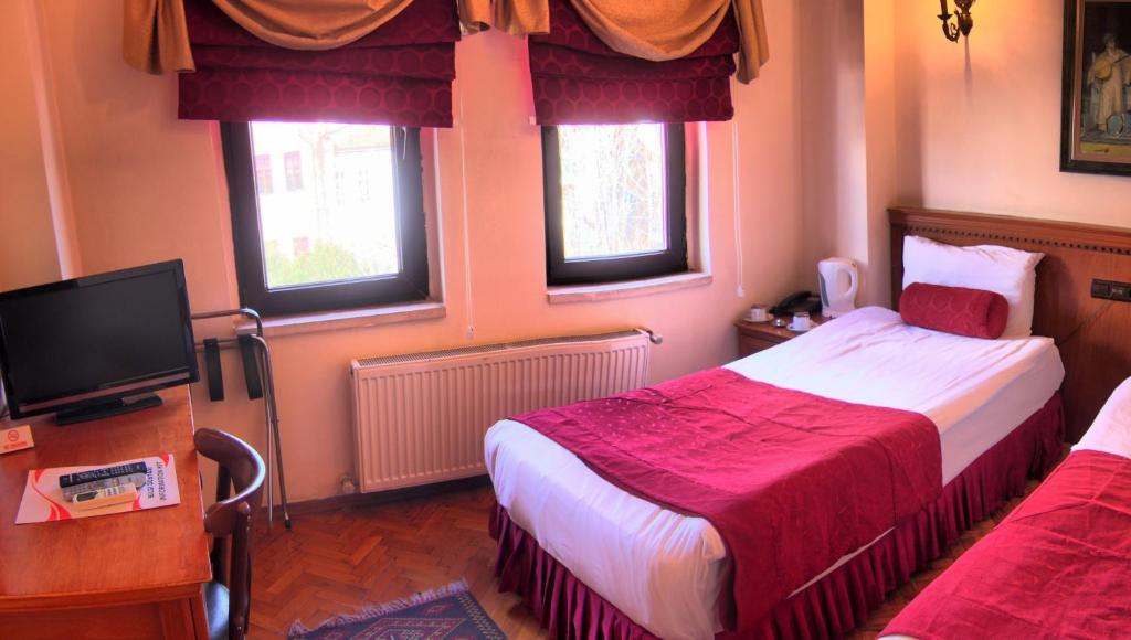 Postel nebo postele na pokoji v ubytování Kervansaray Canakkale Hotel - Special Category