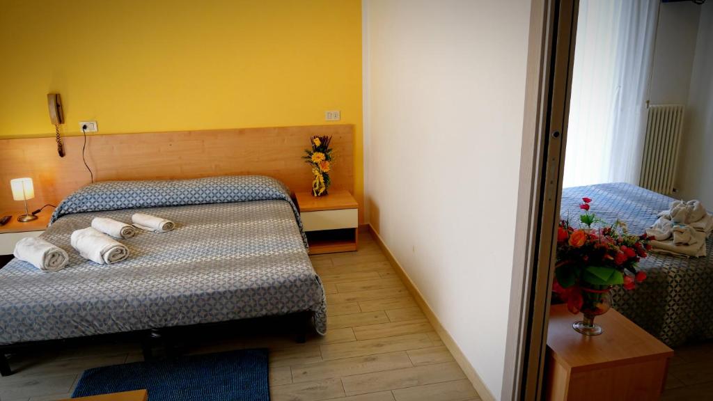 Postel nebo postele na pokoji v ubytování Hotel Frida