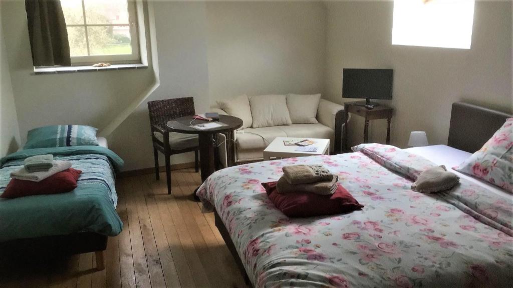Postel nebo postele na pokoji v ubytování B&B Molen Ter Walle