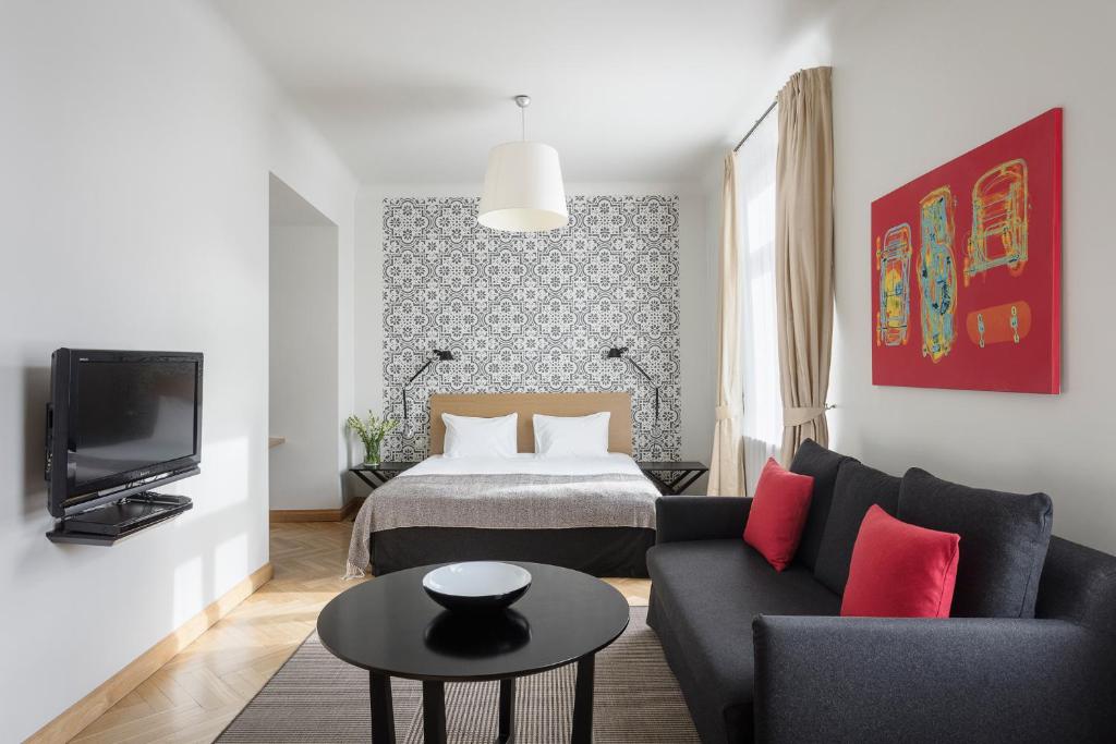 TV a/nebo společenská místnost v ubytování Neiburgs Hotel