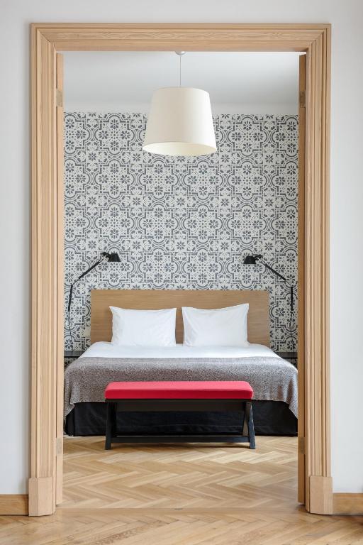Postel nebo postele na pokoji v ubytování Neiburgs Hotel