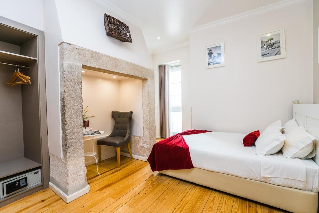 Postel nebo postele na pokoji v ubytování Lisbon Arsenal Suites