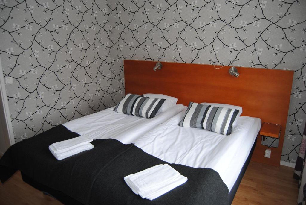 Postel nebo postele na pokoji v ubytování Arena Hotell