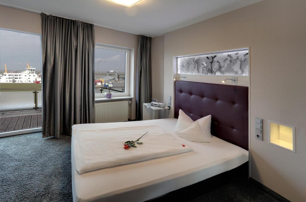 Postel nebo postele na pokoji v ubytování Hotel Fährhaus