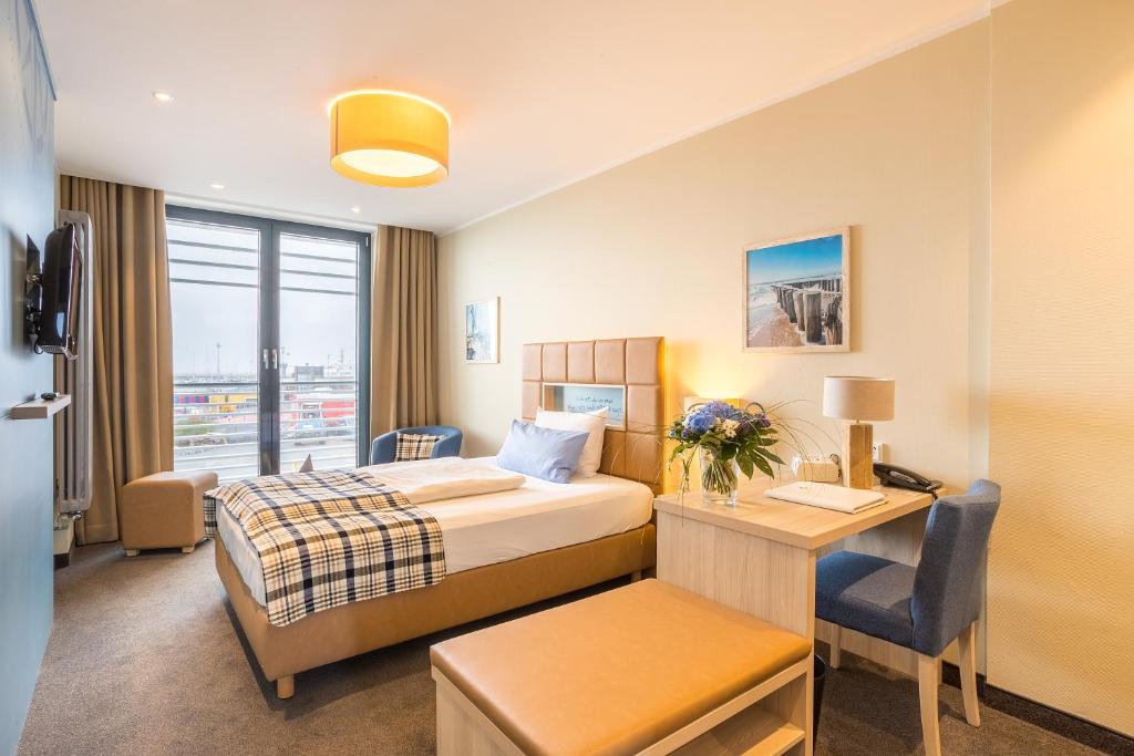 Postel nebo postele na pokoji v ubytování Hotel Fährhaus