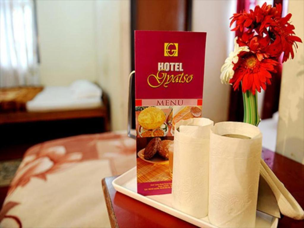 a tray with toilet paper and a box on a table at Hotel Gyatso in Gangtok