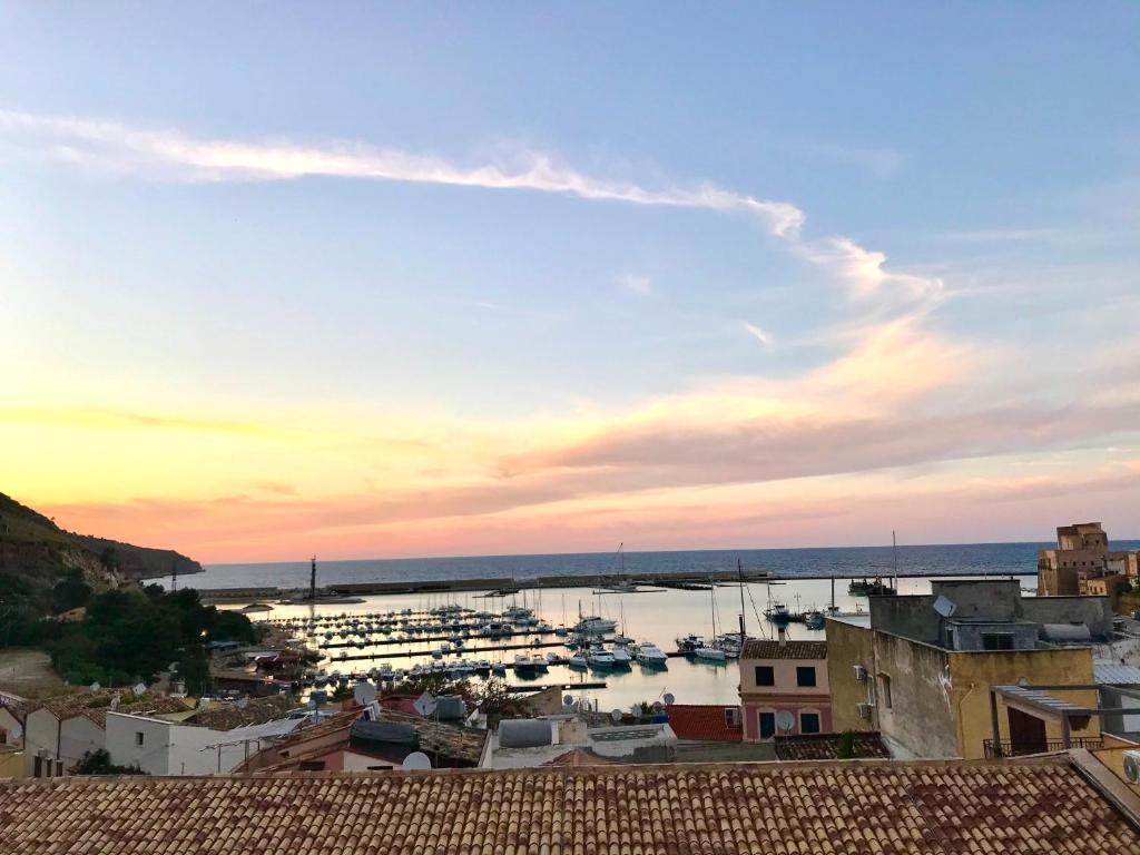 a view of a harbor with boats in the water at Castellammare Smart Rooms in Castellammare del Golfo