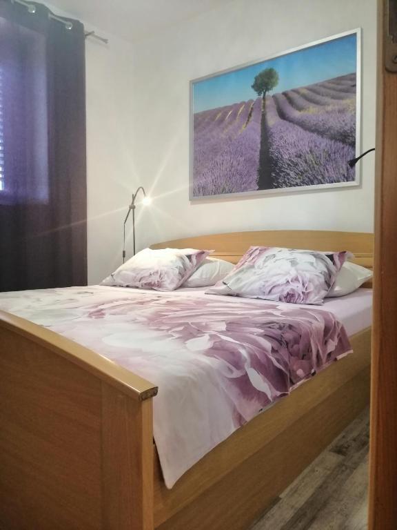Łóżko lub łóżka w pokoju w obiekcie Apartments Pržina