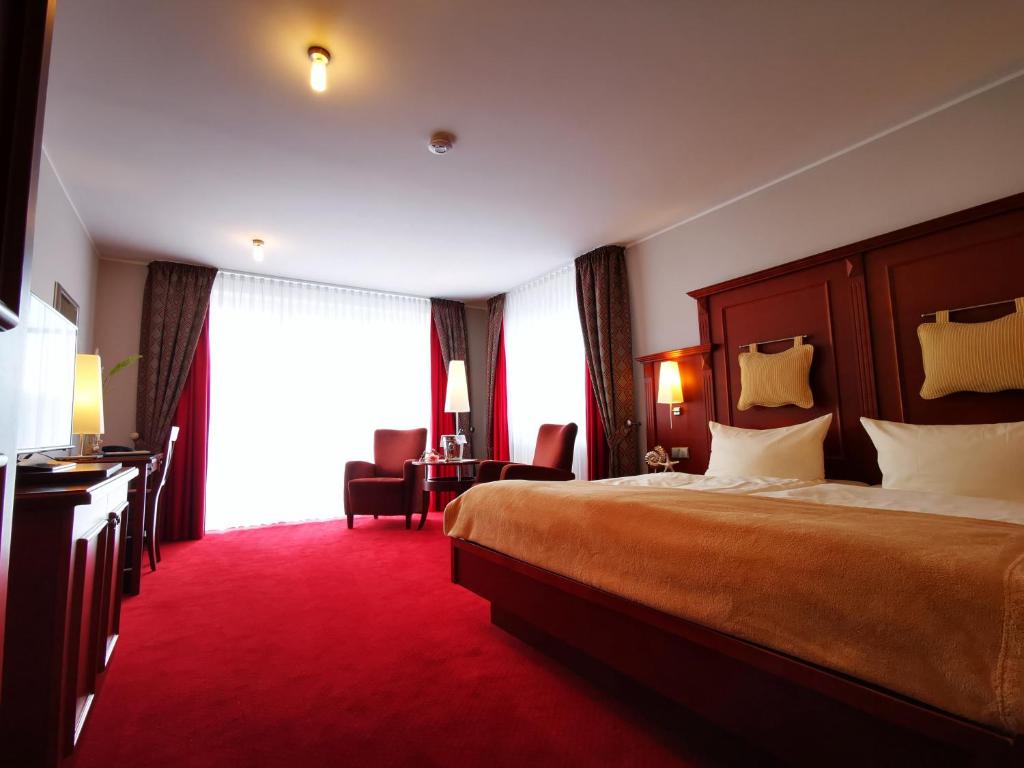 Postel nebo postele na pokoji v ubytování Hotel Garni Bendiks