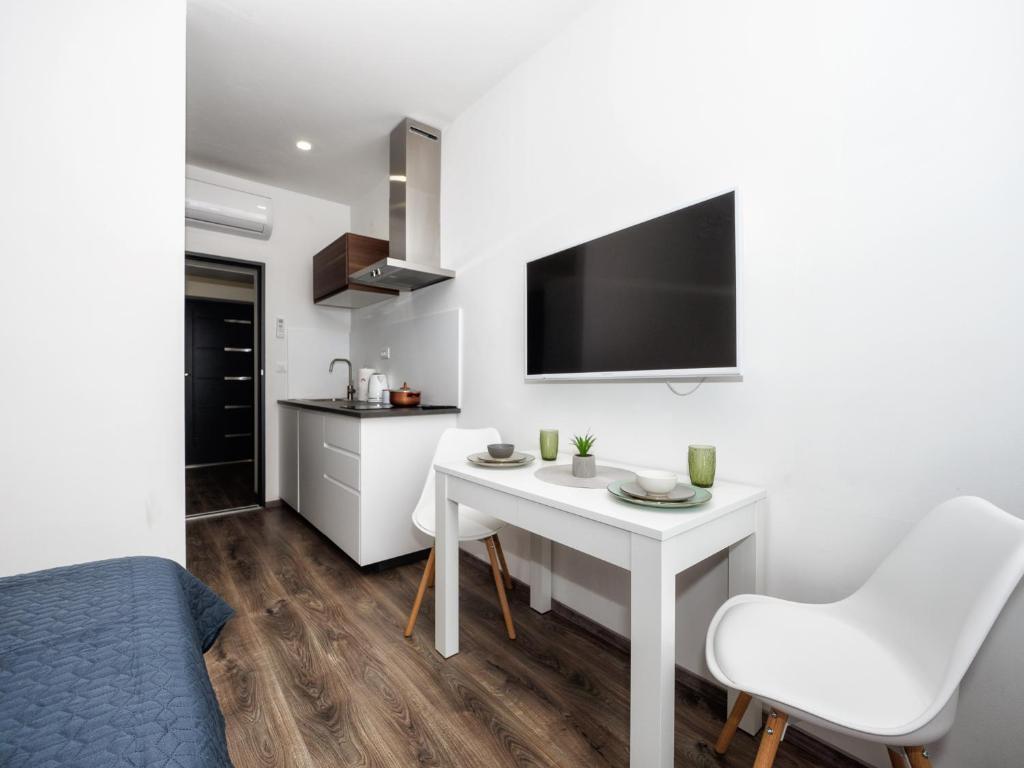 Telewizja i/lub zestaw kina domowego w obiekcie Arena Delight Studio Apartments