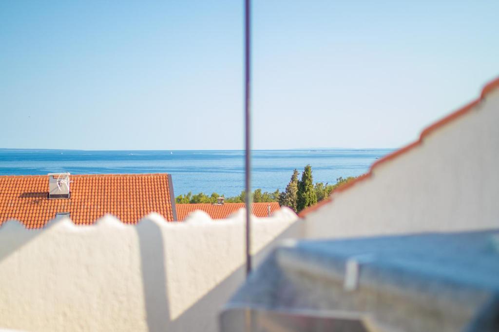a view of the ocean from a building at Albert Apartaments Krk in Krk