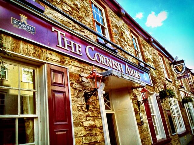 a building with a sign that reads the camera inn at The Cornish Arms in Tavistock
