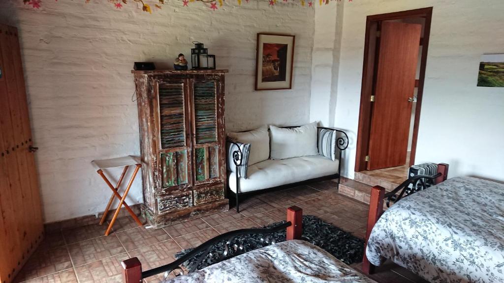 Postel nebo postele na pokoji v ubytování Hacienda El Rejo