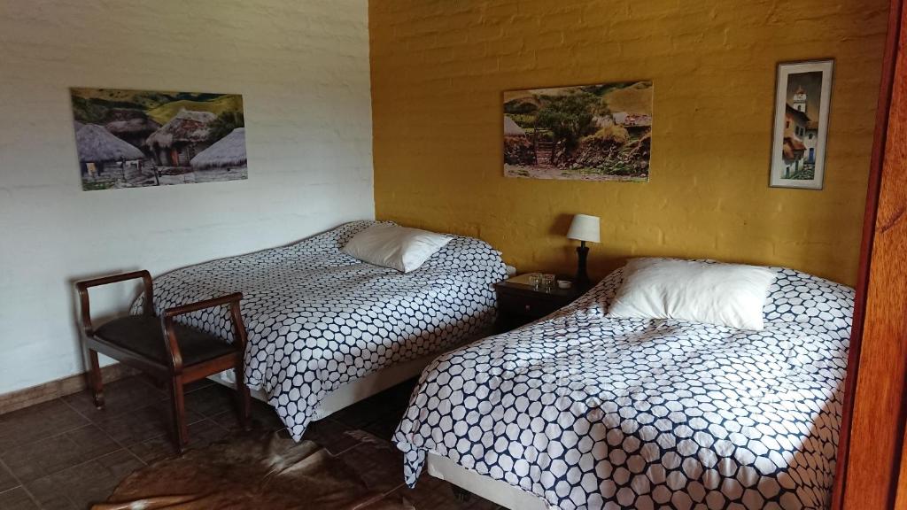 Postel nebo postele na pokoji v ubytování Hacienda El Rejo