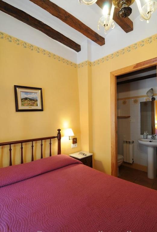 Postel nebo postele na pokoji v ubytování Casa Estivill