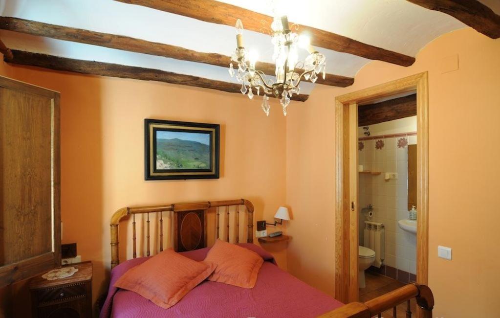 Postel nebo postele na pokoji v ubytování Casa Estivill