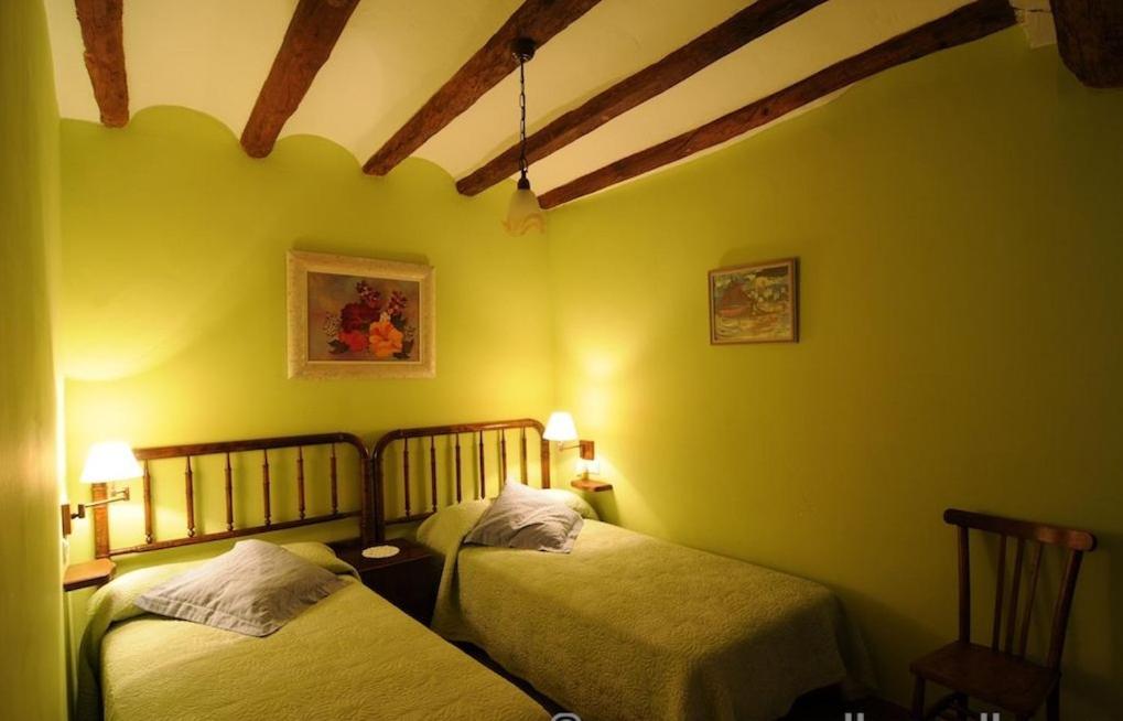 Postel nebo postele na pokoji v ubytování Casa Estivill