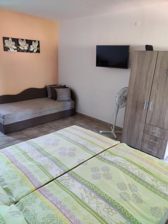 Posteľ alebo postele v izbe v ubytovaní Vasti Apartman