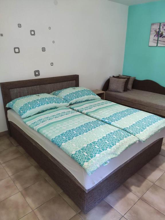 Posteľ alebo postele v izbe v ubytovaní Vasti Apartman