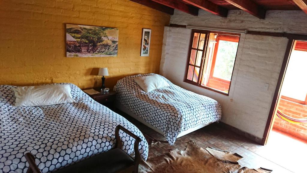 Postel nebo postele na pokoji v ubytování Hacienda El Rejo