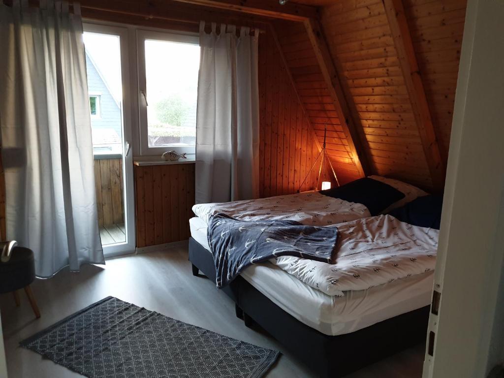 Postel nebo postele na pokoji v ubytování Haus Lerche