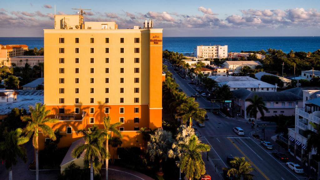a large building with a large clock on it at Residence Inn by Marriott Delray Beach in Delray Beach