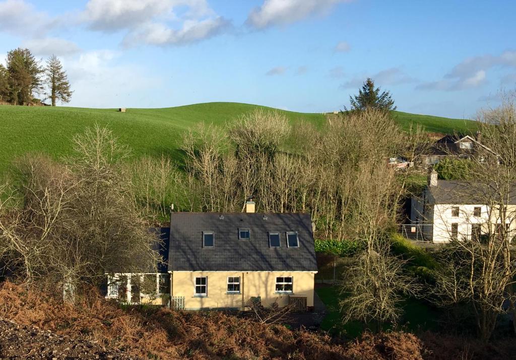 an aerial view of a house on a hill at Streamside B and B with Parking in Drom dhá Liag