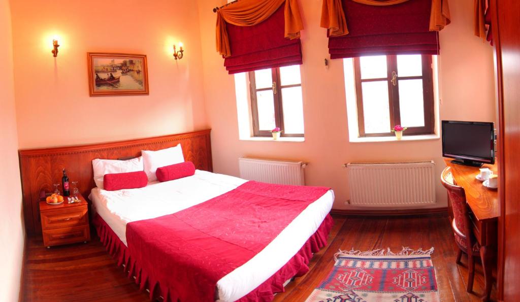 Postel nebo postele na pokoji v ubytování Kervansaray Canakkale Hotel - Special Category