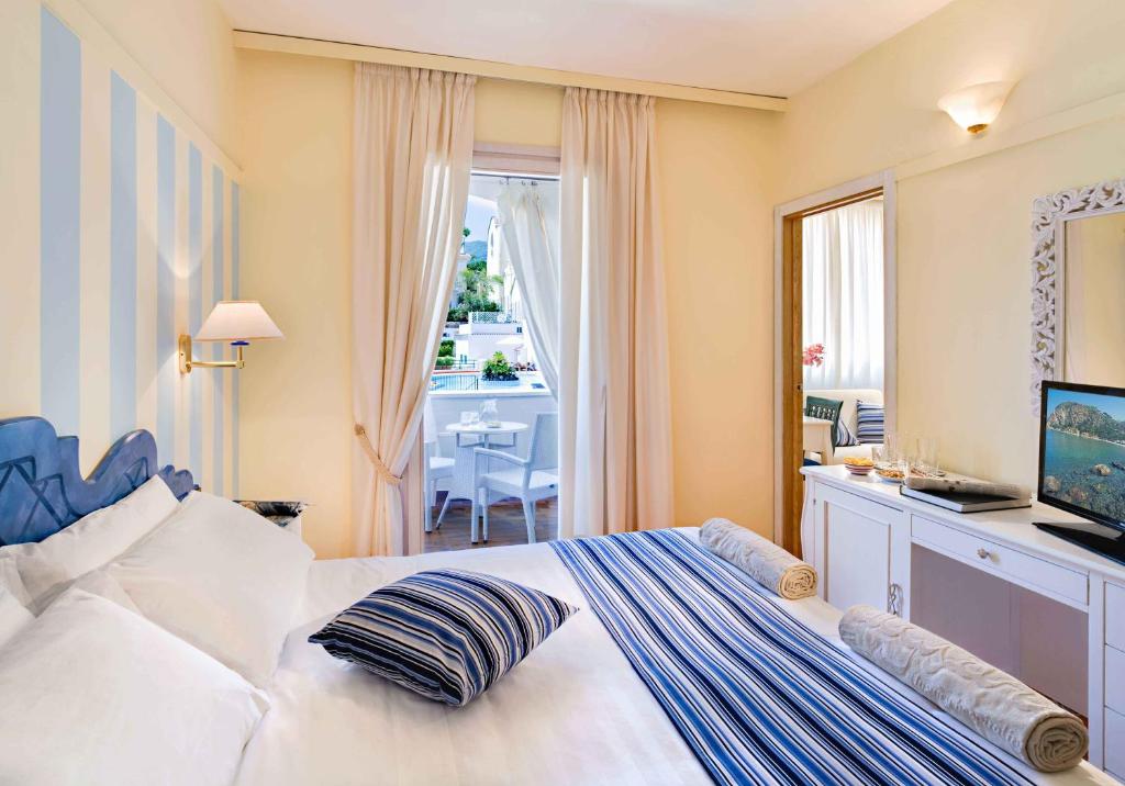 Postel nebo postele na pokoji v ubytování Hotel Mare Blu Terme